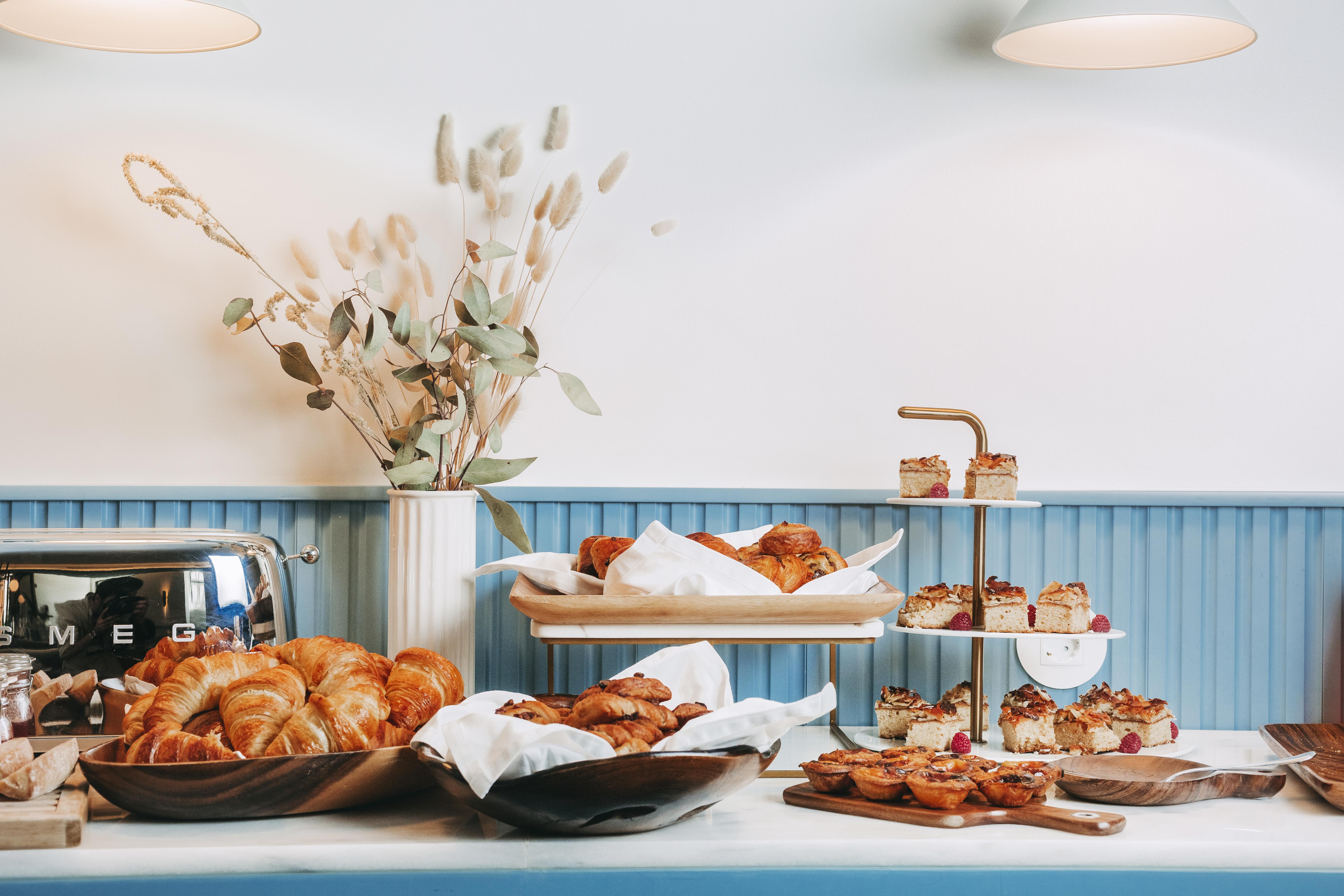 The Vintage Hotel & Spa Lisbon Exterior photo A selection of pastries at a bakery